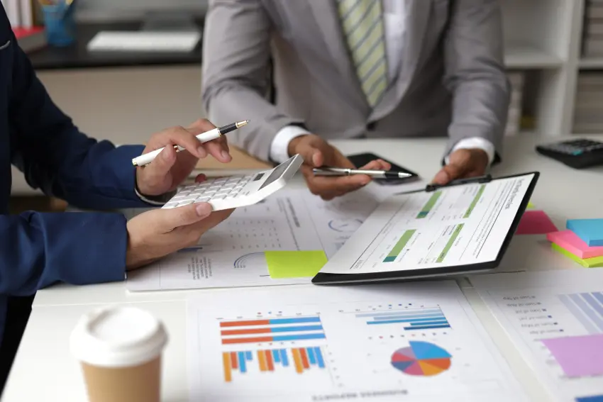 Auditor team working in office. Businessman meeting with financial advisors discussing budget planning and analyzing company financial reports.
